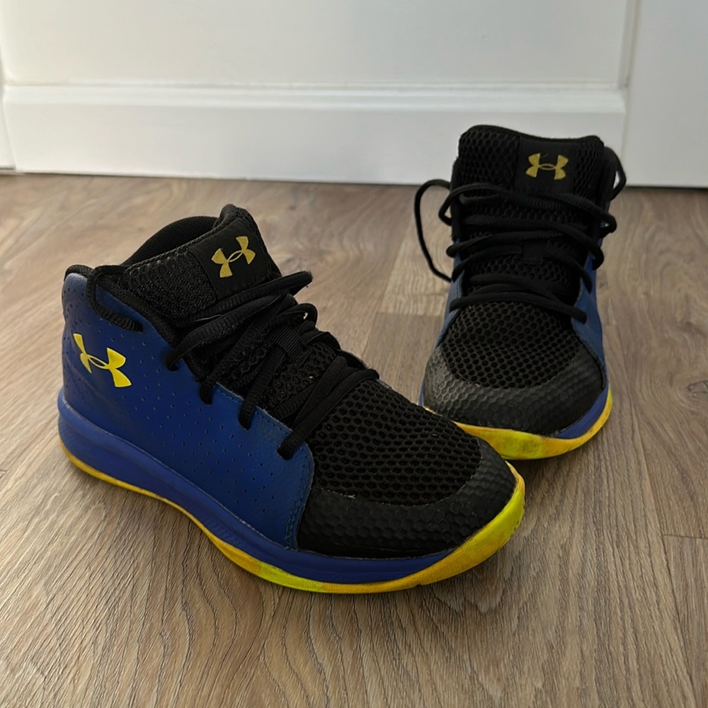Kids under armour high top basketball shoes in blue and yellow